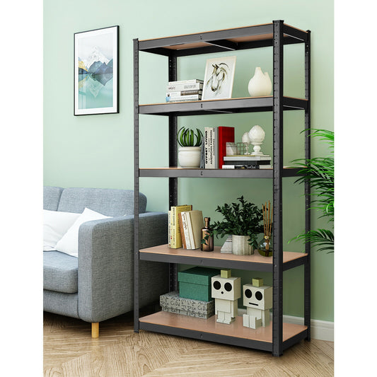 A 5-tier metal and wood shelving unit with black metal frames and brown wooden shelves, placed in a room with a gray sofa, decorative items, and a green plant.