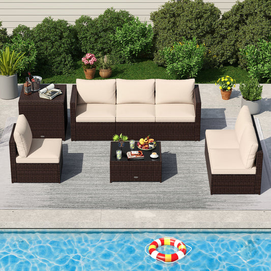An 8-piece patio furniture set with beige cushions, including a corner sofa, an armless sofa, a coffee table with a glass top, and a storage box, set on a outdoor setting with a pool in the background.