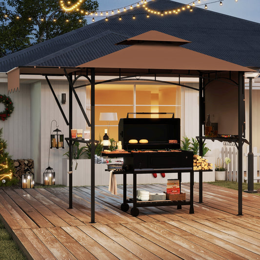 A grill gazebo with dual side awnings and two shelves, in a dual-tone color scheme, set up on a wooden deck with outdoor decorations in the background.